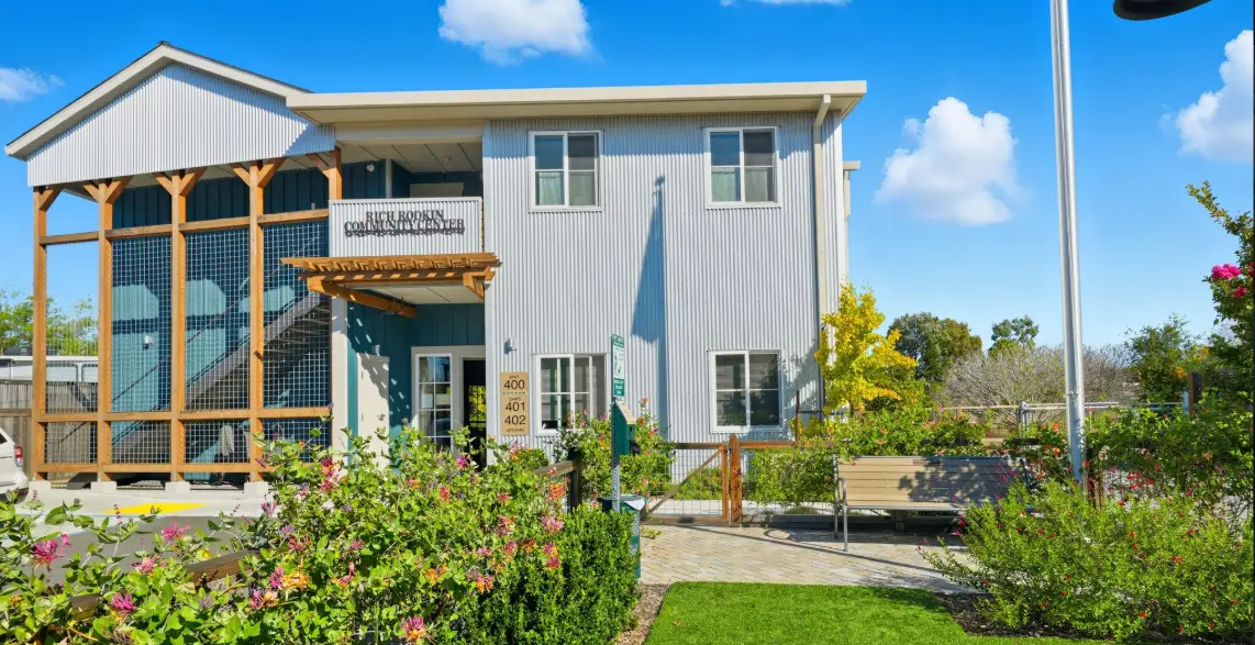 Landscape view of River City Senior Apartments community center building